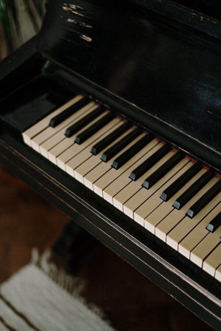 A piano keyboard with the keys on top of it.